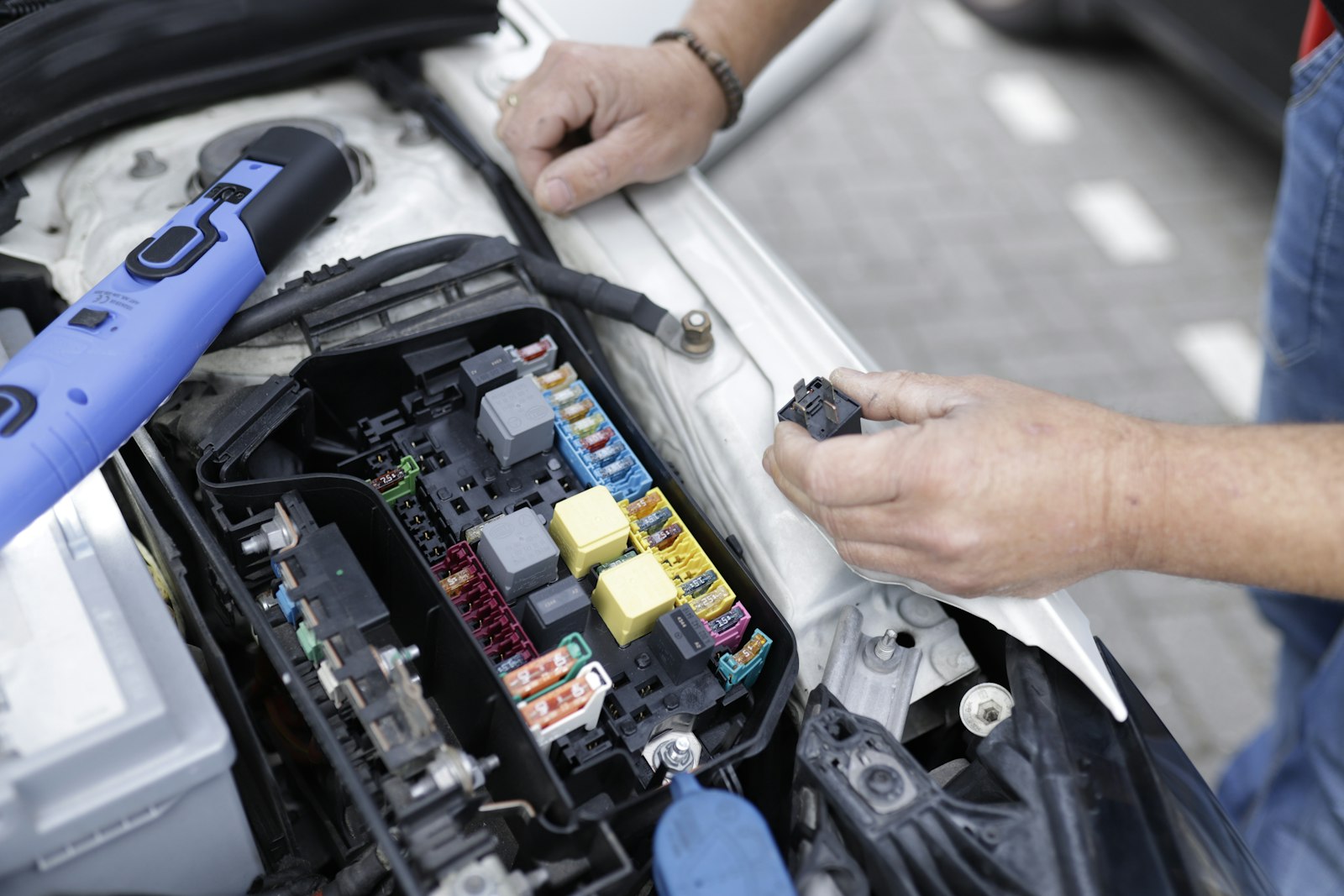 Topping off oil in an engine bay